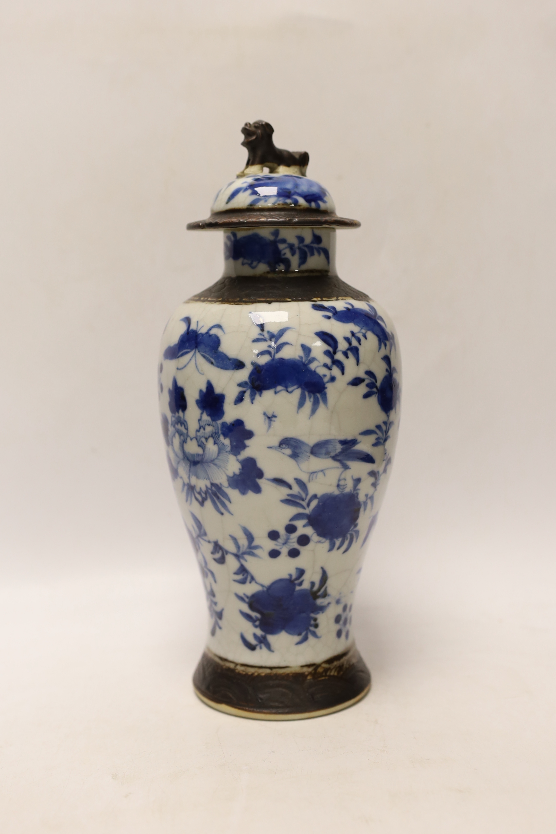 A late 19th century Chinese crackle glaze vase and cover, 30cm